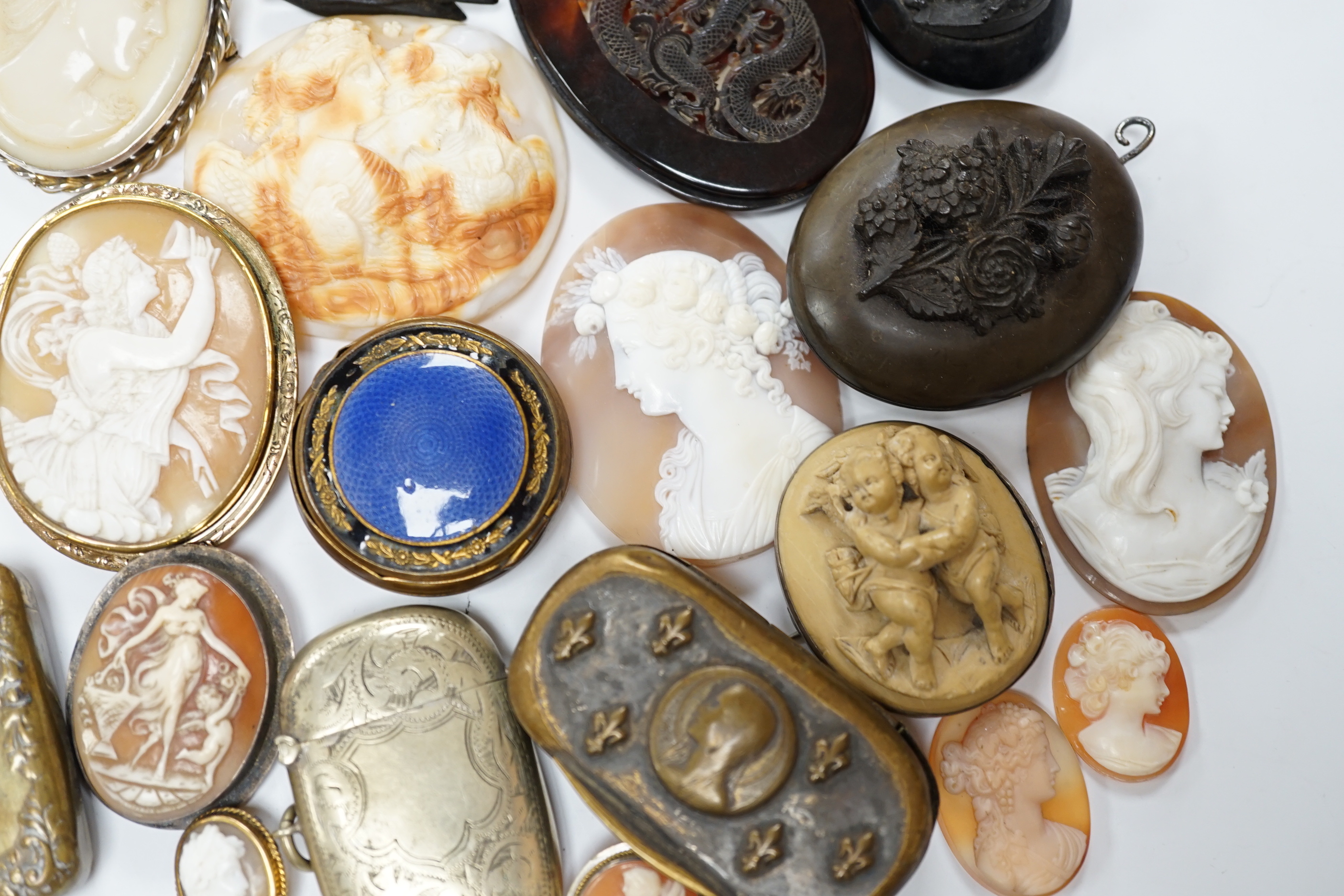 Five assorted unmounted carved cameo shells, largest 57mm, four other mounted cameo brooches including three shell, two base metal vestas and a box and sundry other items.
